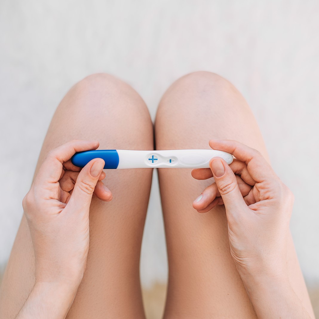 A woman holding a free pregnancy test in Freeport, Florida