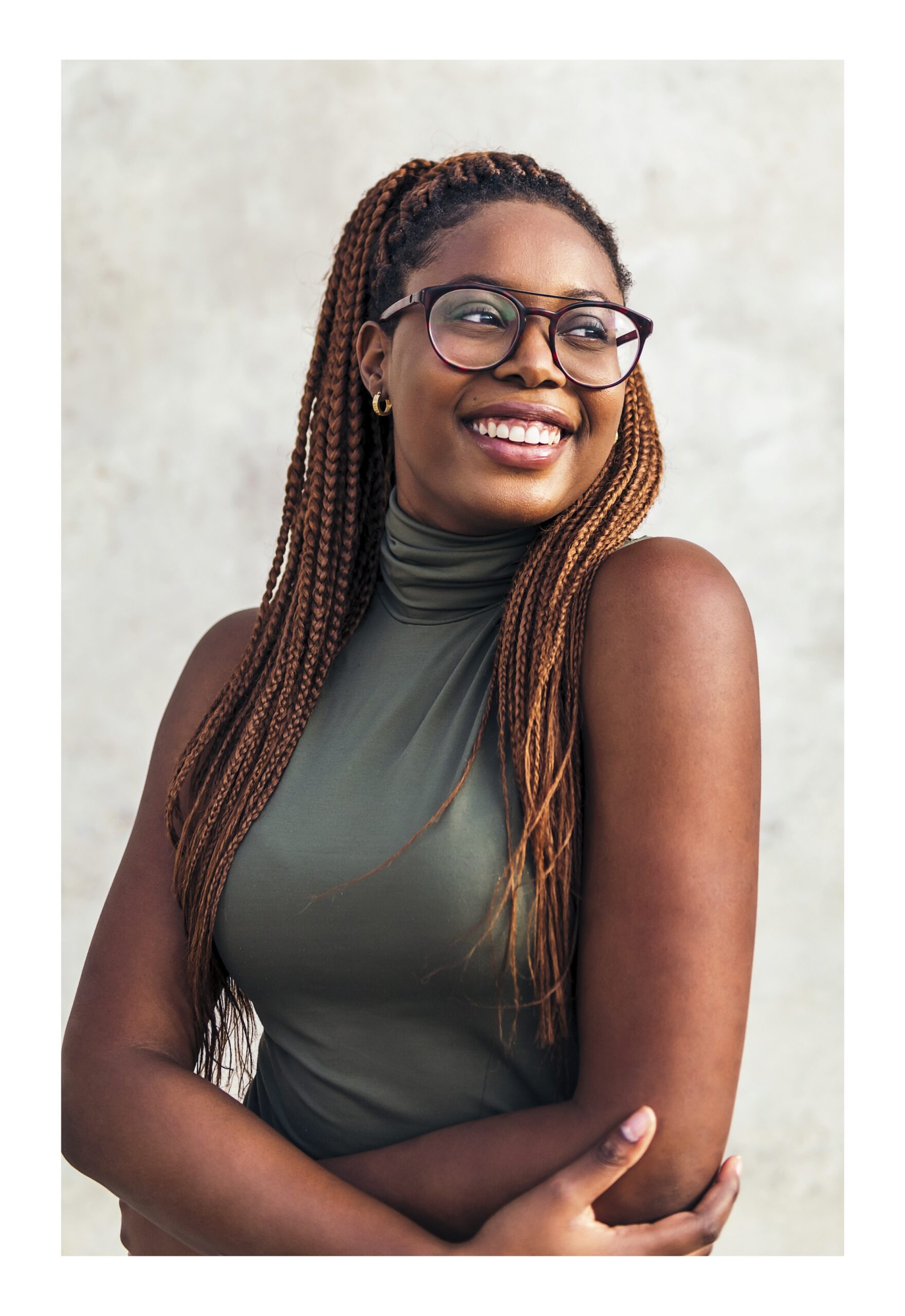 A woman smiling because she knows she can get pregnancy support at Lauren's Legacy Pregnancy Center